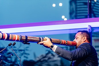 David Williams performs didgeridoo as part of an acknowledgment of country at the official opening of ‘Water’